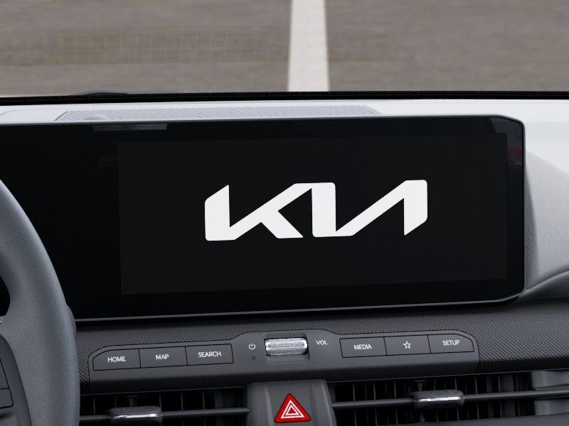 2026 Kia K4 LXS in Snow White Pearl — front three-quarter view