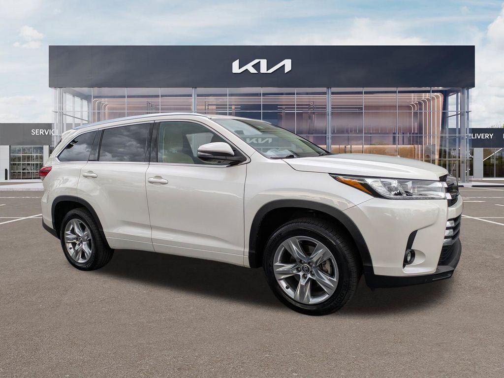 2019 Toyota Highlander Limited in Blizzard Pearl — front three-quarter view