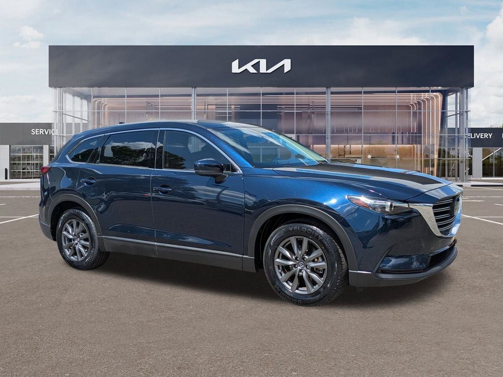 2023 Mazda Mazda CX-9 Touring in Deep Crystal Blue Mica — front three-quarter view