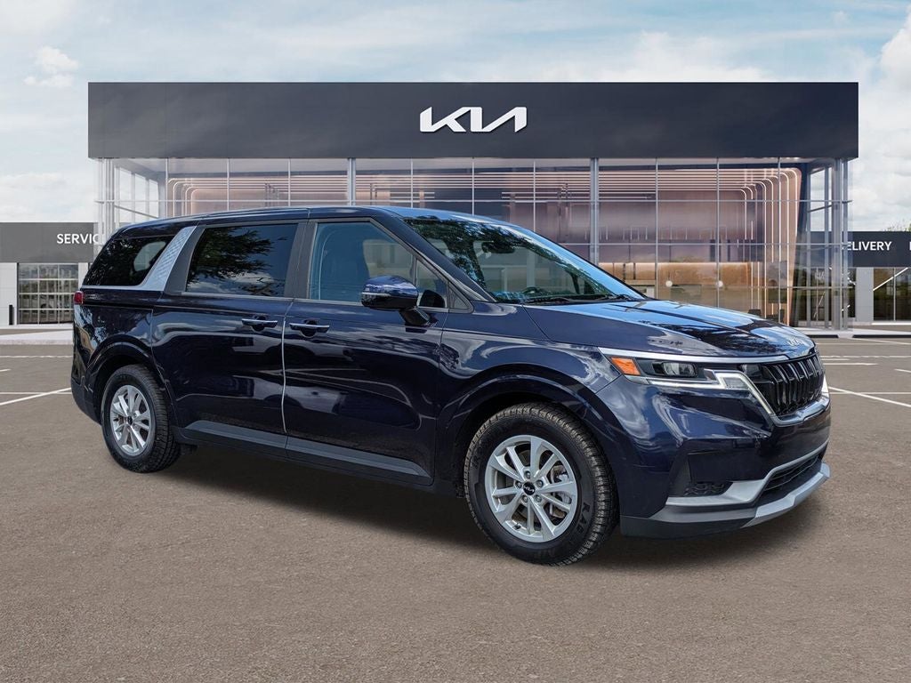 2024 Kia Carnival LX in Deep Chroma Blue — front three-quarter view