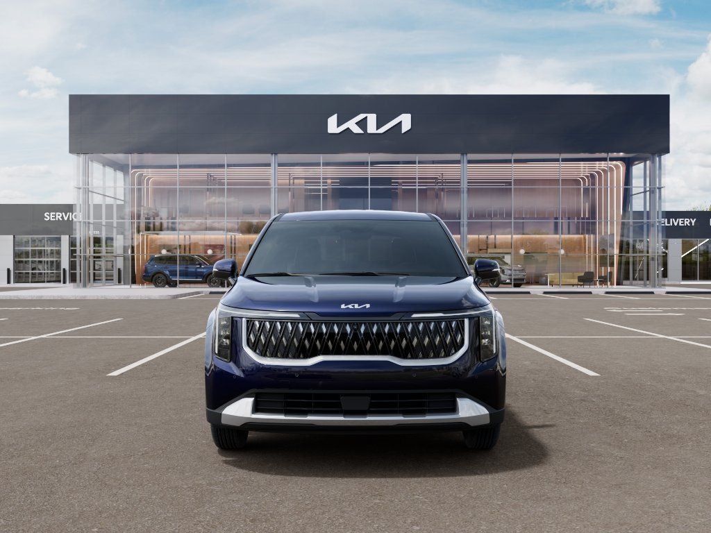 2026 Kia Carnival LXS in Deep Chroma Blue — front three-quarter view
