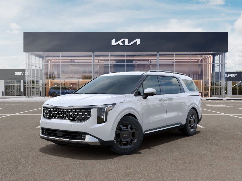 2026 Kia Carnival SX in Snow White Pearl — front three-quarter view