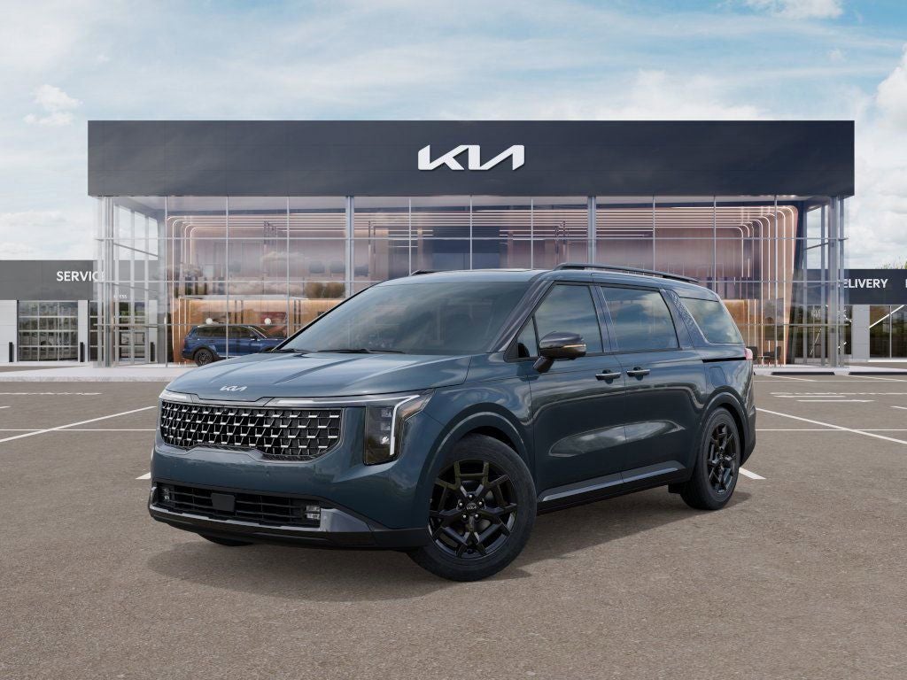 2026 Kia Carnival SX in Astra Blue — front three-quarter view