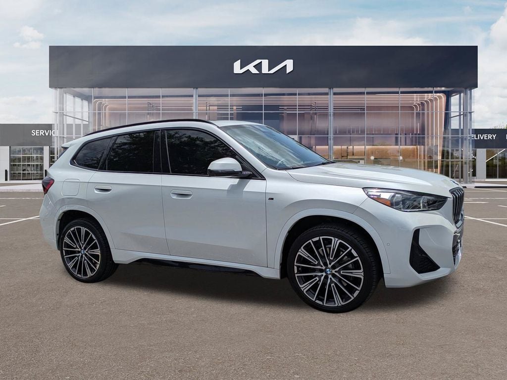 2023 BMW X1 xDrive28i in Mineral White Metallic — front three-quarter view