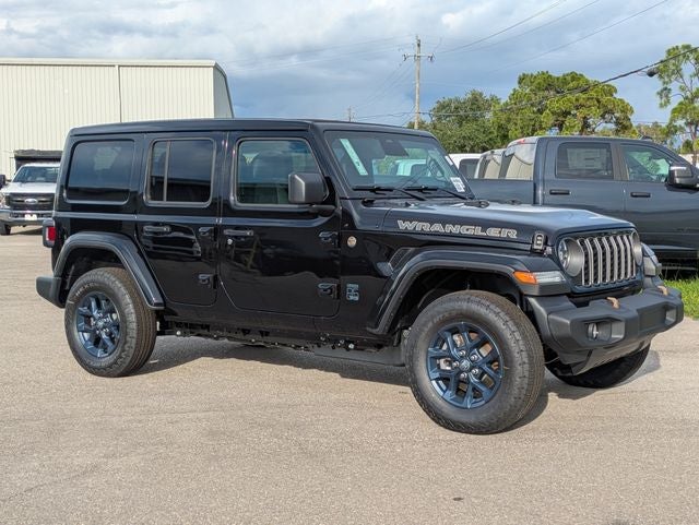 2026 Jeep Wrangler WRANGLER 4-DOOR 85TH ANNIVERSARY EDITION in Black Clear-Coat Exterior Paint — front three-quarter view