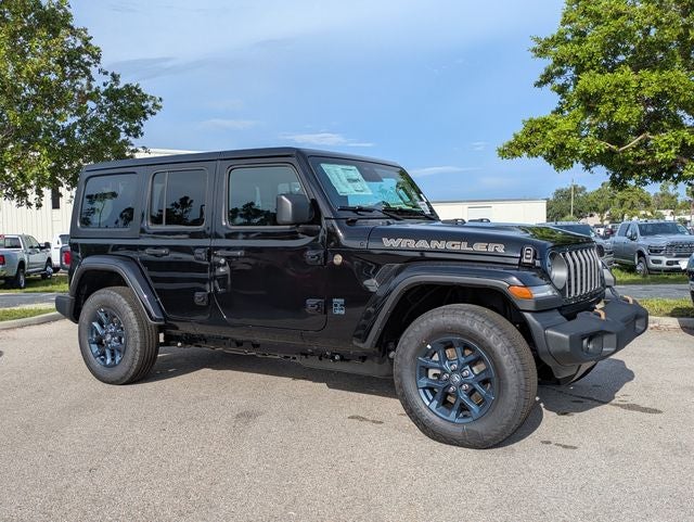 2026 Jeep Wrangler WRANGLER 4-DOOR 85TH ANNIVERSARY EDITION in Black Clear-Coat Exterior Paint — front three-quarter view