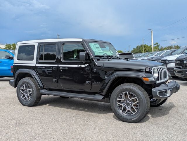 2026 Jeep Wrangler WRANGLER 4-DOOR SAHARA in Black Clear-Coat Exterior Paint — front three-quarter view