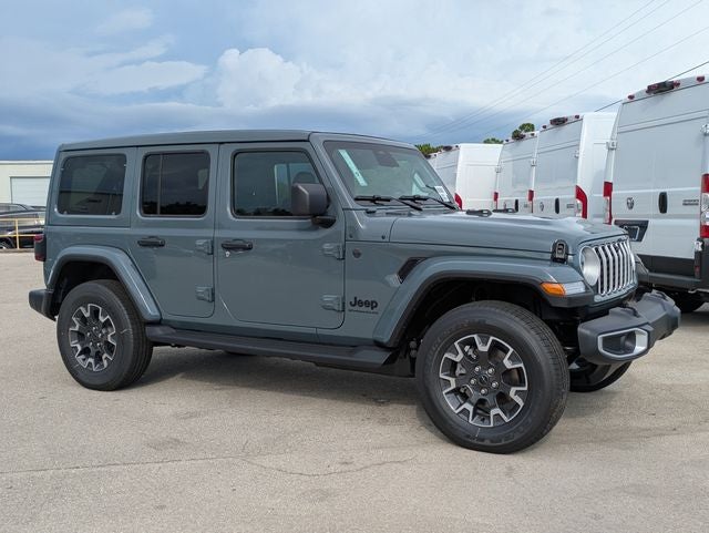 2026 Jeep Wrangler WRANGLER 4-DOOR SAHARA in Anvil Clear-Coat Exterior Paint — front three-quarter view