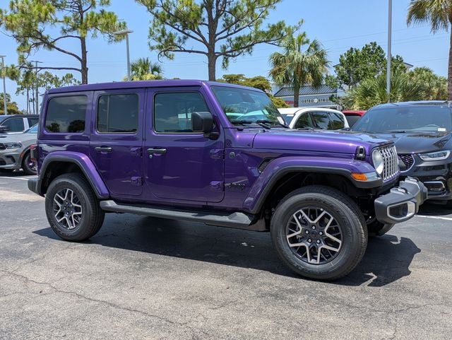 2026 Jeep Wrangler WRANGLER 4-DOOR SAHARA in Reign Exterior Paint — front three-quarter view
