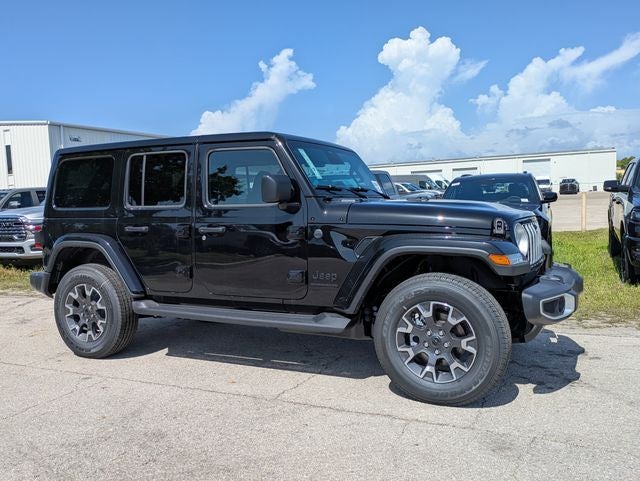 2026 Jeep Wrangler WRANGLER 4-DOOR SAHARA in Black Clear-Coat Exterior Paint — front three-quarter view