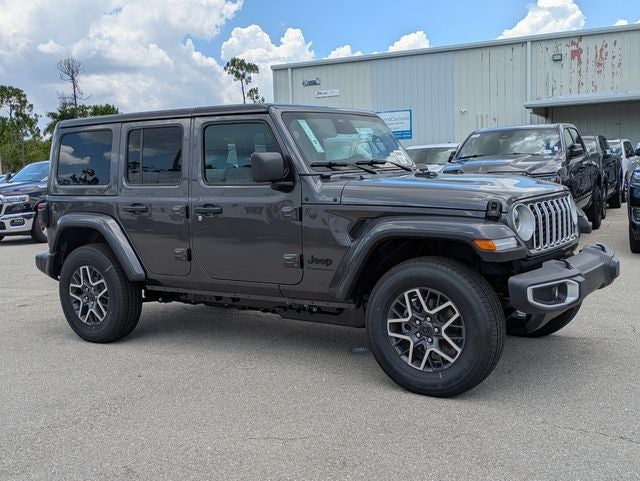 2026 Jeep Wrangler WRANGLER 4-DOOR SAHARA in Granite Crystal Metallic Clear-Coat Exterior Paint — front three-quarter view