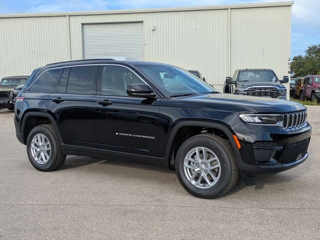 2026 Jeep Grand Cherokee GRAND CHEROKEE LAREDO X 4X2 in Diamond Black Crystal Pearl-Coat Exterior Paint — front three-quarter view
