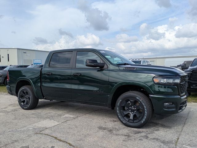 2026 RAM Ram 1500 RAM 1500 BIG HORN CREW CAB 4X4 5'7' BOX in Serrano-Green Metallic Exterior Paint — front three-quarter view