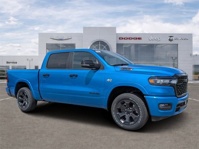 2026 RAM Ram 1500 RAM 1500 BIG HORN CREW CAB 4X4 5'7' BOX in Hydro Blue Pearl-Coat Exterior Paint — front three-quarter view