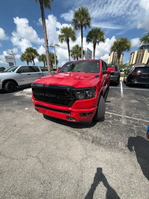 2020 RAM 1500 Big Horn Crew Cab 4x4 5'7' Box in Flame Red Clearcoat — front three-quarter view