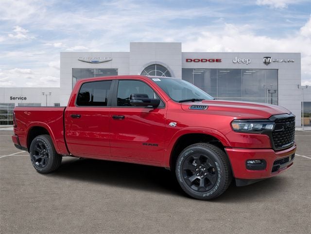 2026 RAM Ram 1500 RAM 1500 BIG HORN CREW CAB 4X4 5'7' BOX in Molten Red Pearl-Coat Exterior Paint — front three-quarter view