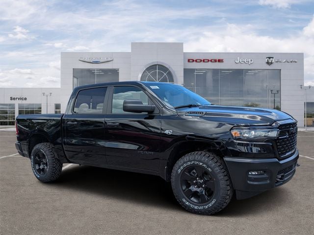2026 RAM Ram 1500 RAM 1500 WARLOCK CREW CAB 4X4 5'7' BOX in Diamond Black Crystal Pearl-Coat Exterior Paint — front three-quarter view