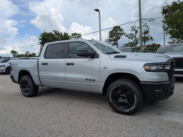 2026 RAM Ram 1500 RAM 1500 WARLOCK CREW CAB 4X4 5'7' BOX in Silver Zynith Exterior Paint — front three-quarter view