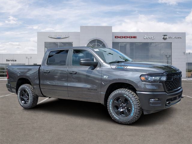 2026 RAM Ram 1500 RAM 1500 WARLOCK CREW CAB 4X4 5'7' BOX in Granite Crystal Metallic Clear-Coat Exterior Paint — front three-quarter view