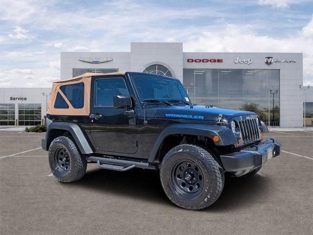 2011 Jeep Wrangler Sport in Black Clearcoat — front three-quarter view