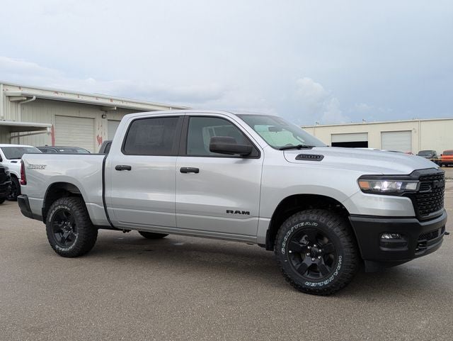 2026 RAM Ram 1500 RAM 1500 WARLOCK CREW CAB 4X4 5'7' BOX in Silver Zynith Exterior Paint — front three-quarter view