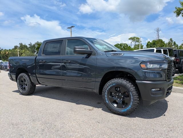 2026 RAM Ram 1500 RAM 1500 WARLOCK CREW CAB 4X4 5'7' BOX in Forged Blue Metallic Exterior Paint — front three-quarter view